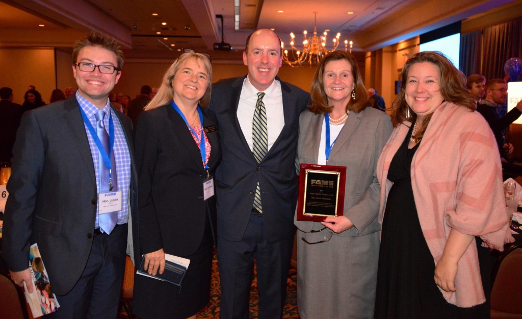 Sen. Linda Valentino, D-Saco, receiving award. From left Rep. Justin Chenette , Sen. Rebecca Millett, Bill Norbert, Governmental Affairs and Communications Manager for FAME, and Rep. Diane Russell.