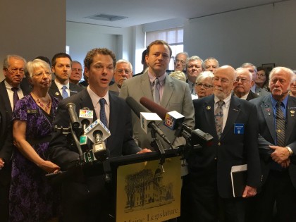 Sen. Alfond, D-Portland, at podium. 