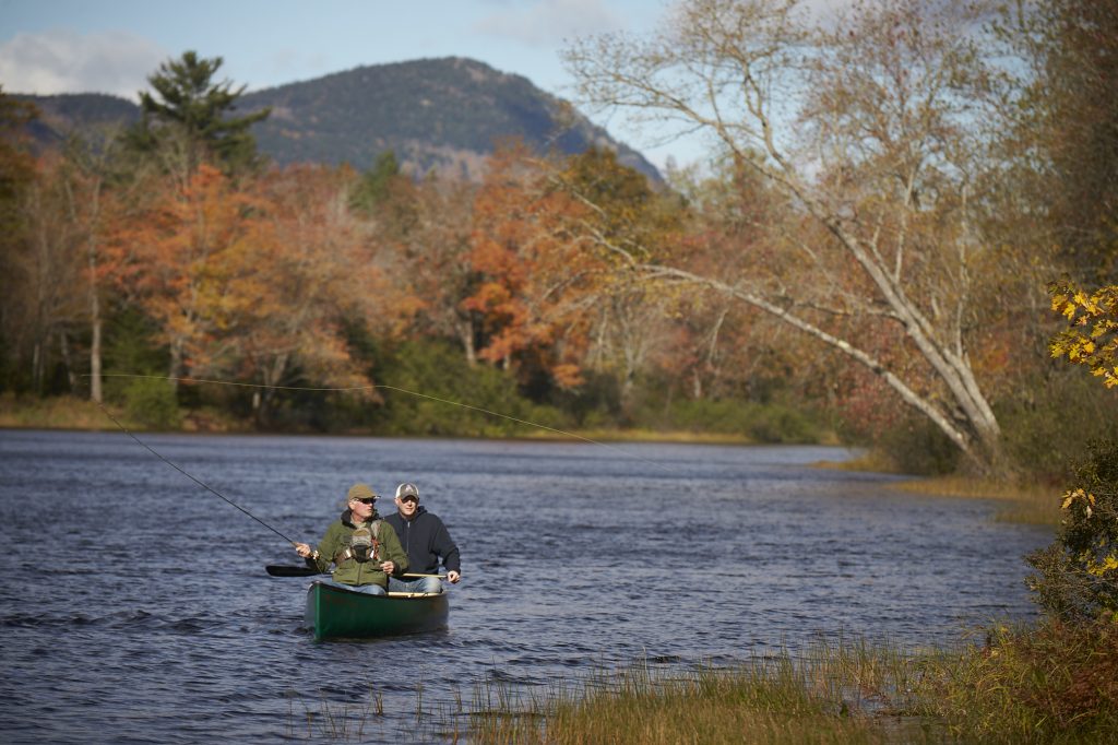 Two anglers fly fish from a canoe in the East Branch of the Penobscot River. Photo by EPI. 