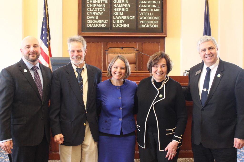 Sen. Matt Pouliot, R-Augusta; Glenn Adams; Sen. Bellows; Hon. Patsy Crockett; and Sen. Scott Cyrway, R-Albion together in the Senate Chamber
