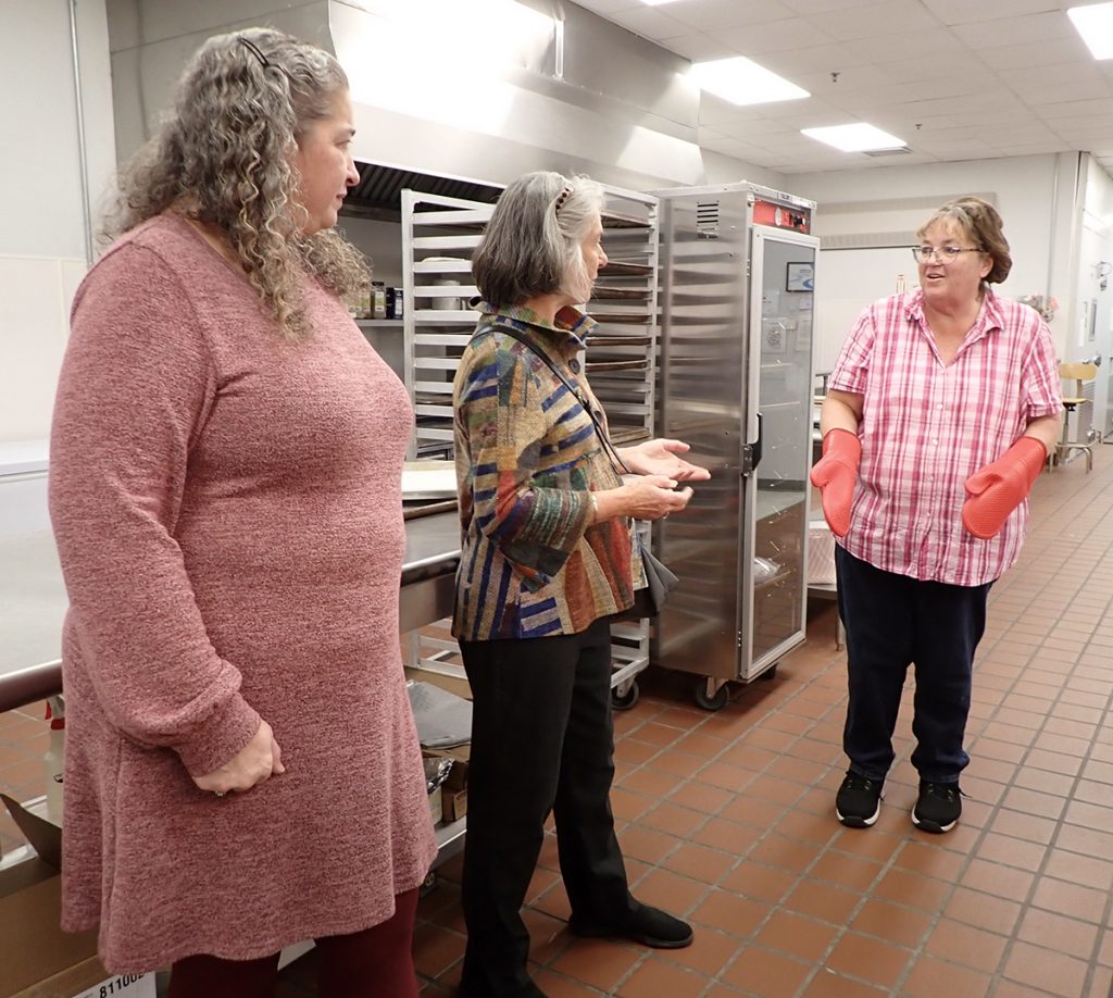 Sen. Eloise Vitelli (center) speaks with Melissa Cole (left), director of food service and nutrition for RSU 1, and Lisa Campbell, food service director for Bath Middle School.